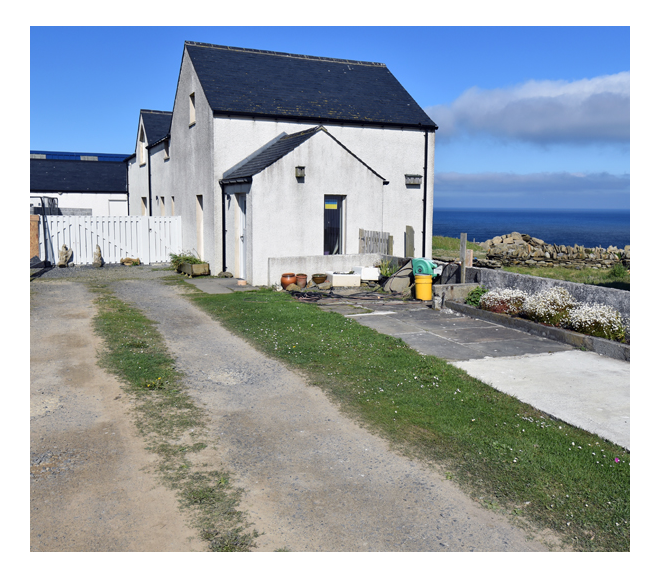 A view of the parking leading up to the shop